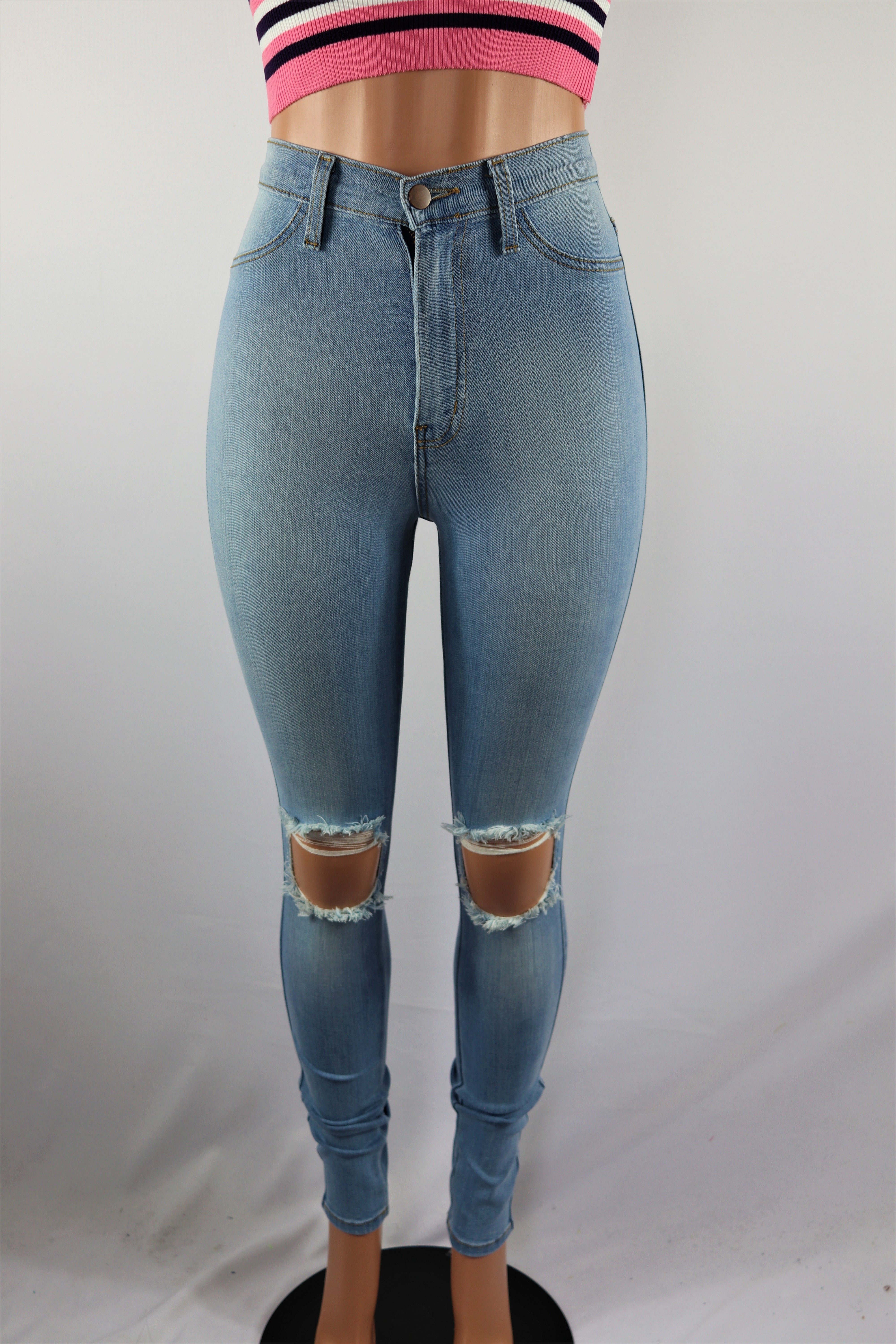 Kenneth Pants - High waisted ripped knee light blue denim jeans pants.