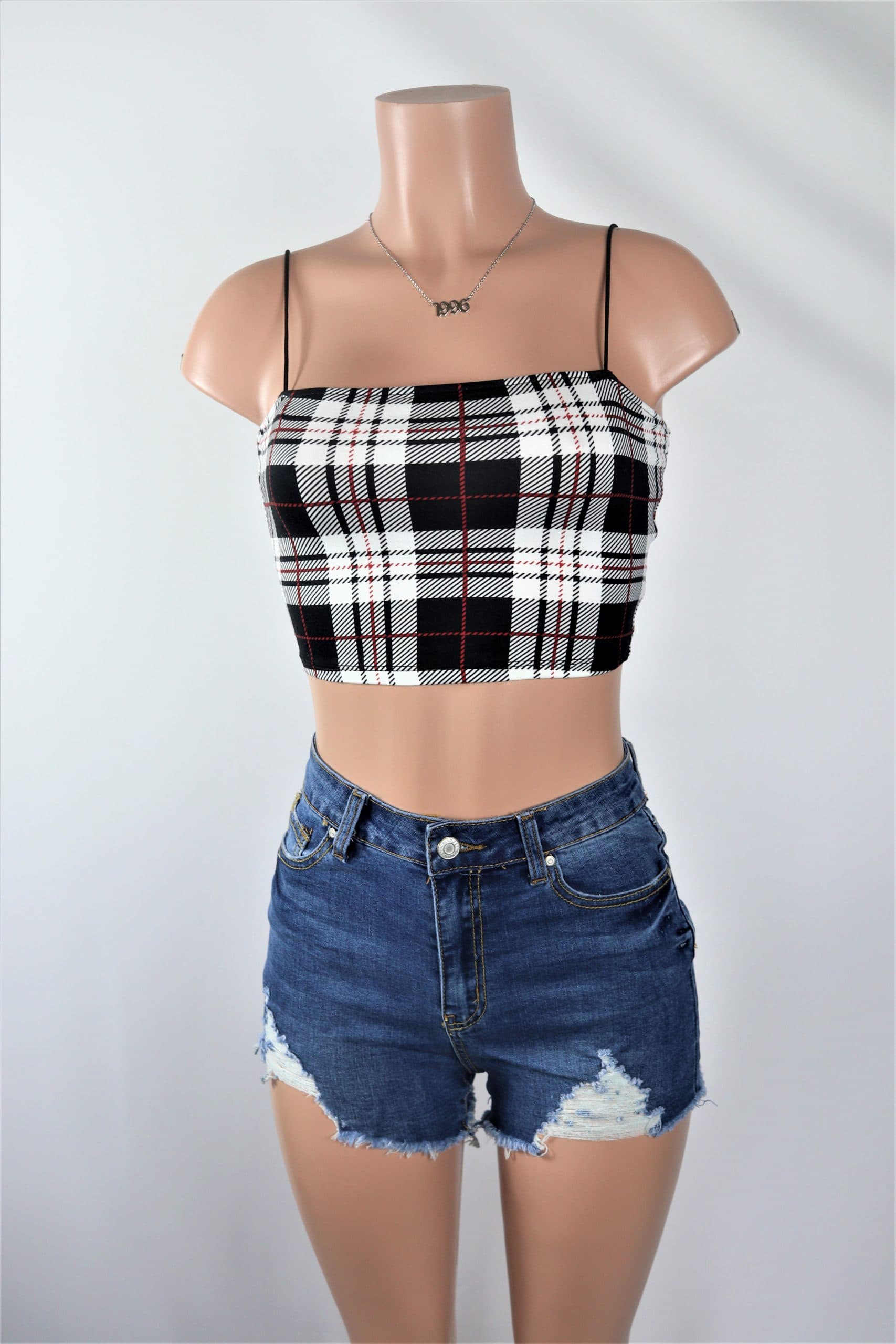 Carter Shorts High waisted ripped shorts in light and dark blue denim.