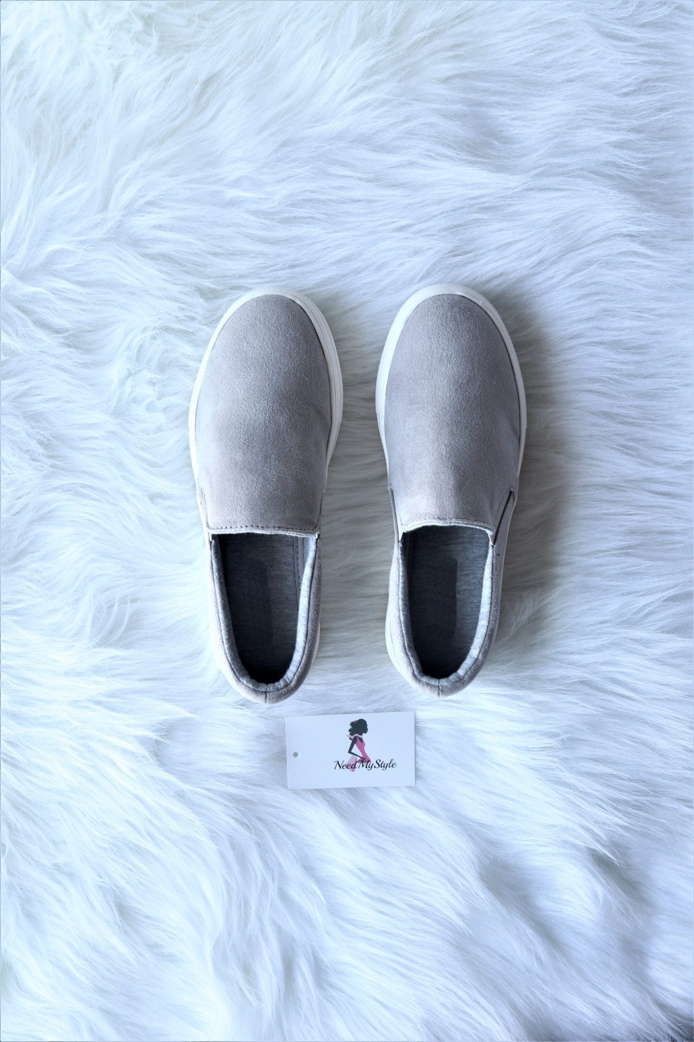 black and grey slip ons