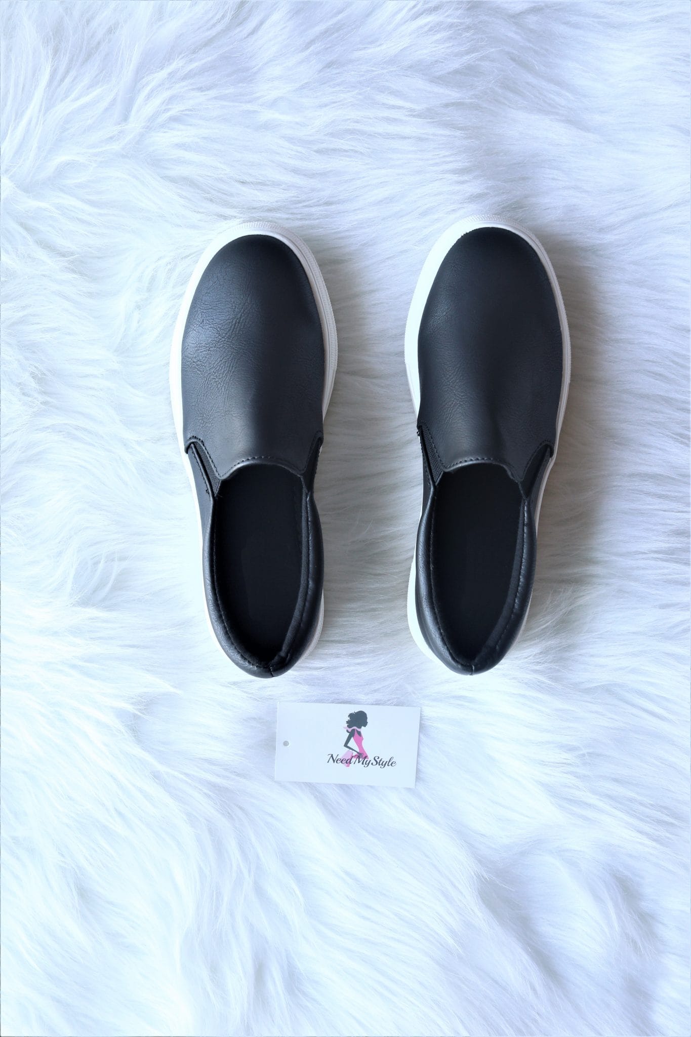 black and grey slip ons