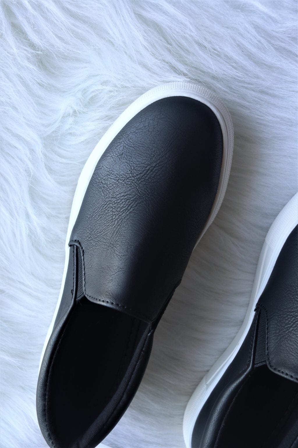 black and grey slip ons