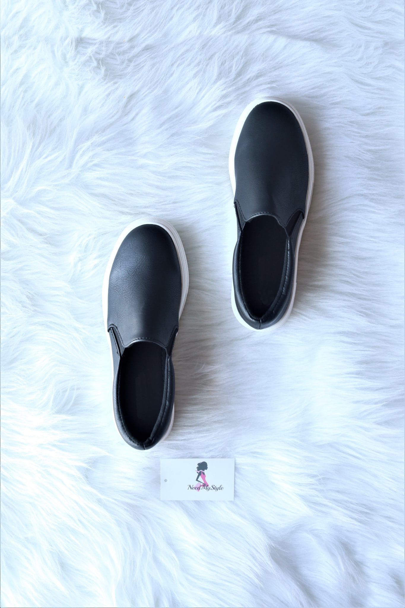 black and grey slip ons